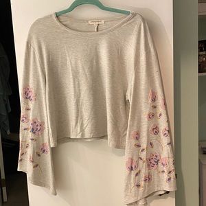 Light gray top with floral design on sleeves